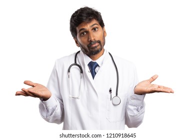 Medic Or Doctor With Perplexed Expression On Face And Palms Up Isolated On White Studio Background