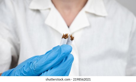 Medic Holding A Broken Cigarette In His Hand, Harm Of Smoking.