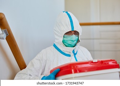 Medic In Protective Clothing During Organ Donation Transport For Surgery In Clinic