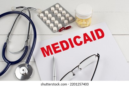MEDICAID text on a keyboard with stethoscope , medical concept - Shutterstock ID 2201257403