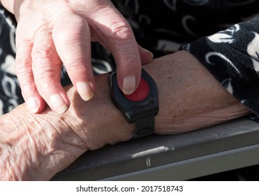 medical alert bracelet with emergency button for elderly people in home nursing - Shutterstock ID 2017518743