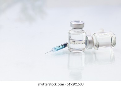 medical ampoules with syringe isolated on white background