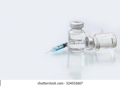 medical ampoules with syringe isolated on white background