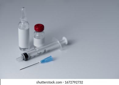 Medical ampoules and syringes, isolated on white 