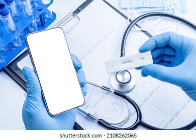 Medical application. Hospital equipment: doctor stethoscope, healthcare charts, syringe with needle and black smartphone with blank screen. Mockup generic device - Powered by Shutterstock