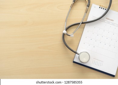 Medical Appointment Book In The Calendar  Stethoscope And Calendar Schedule To Check Up