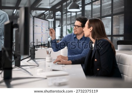 Medical Billing Analysts Using Computers To Code Financial Records
