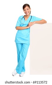 Medical Blank Sign Billboard. Young Woman Doctor / Nurse Showing Empty Sign. Female Medical Professional Standing In Full Body Isolated On White Background.