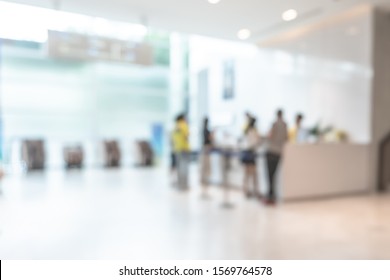 Medical blur background customer reception or patient service counter, office lobby in hospital clinic, or bank business building blurry interior inside waiting hall area 