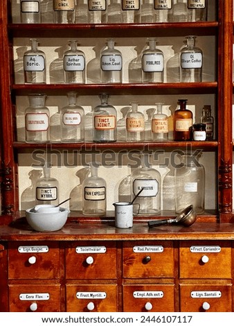 Medical bottles on the shelves in old pharmacy