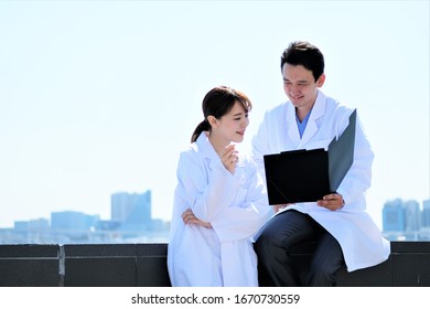 Medical Business Portrait Of Two Asian People