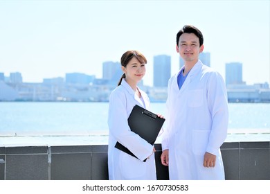 Medical Business Portrait Of Two Asian People