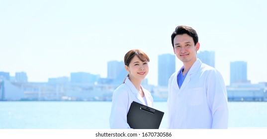 Medical Business Portrait Of Two Asian People