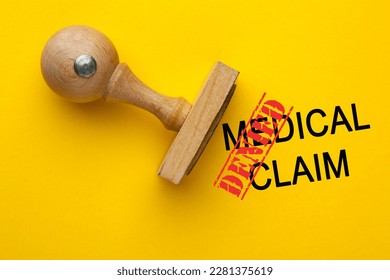 Medical claim denied concept with wooden rubber stamp. - Shutterstock ID 2281375619