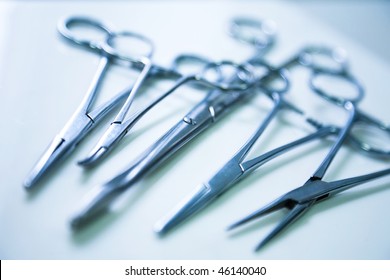 medical clamp instruments on table with shallow depth of field