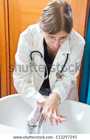 Similar – Female doctor filling out questionnaire to a senior patient