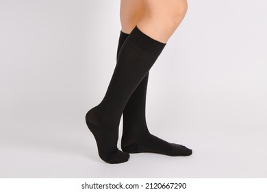 Medical Compression Stockings for varicose veins and venouse therapy. Compression Hosiery. Sock for sports isolated on white background. Black color socks mock up for advertising, branding, design.