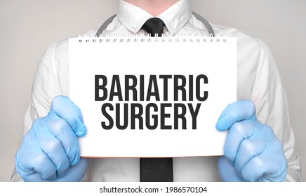 Medical Concept. Doctor Is Writing The Word Bariatric Surgery On White Paper Notepad