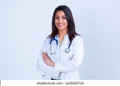 Medical concept of Indian beautiful female doctor in white coat with stethoscope, waist up. Medical student. Woman hospital worker looking at camera and smiling, studio, gray background - Shutterstock ID 1635029716