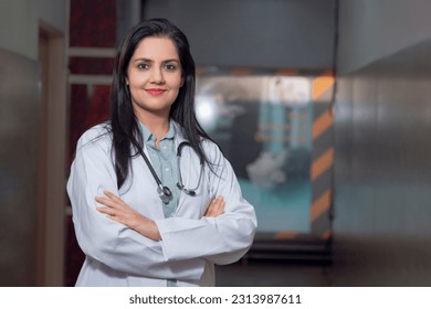 Medical concept, Indian female doctor in white coat with stethoscope standing at hospital. - Powered by Shutterstock