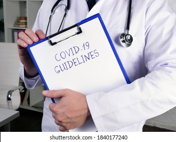 Medical Concept Meaning COVID-19 GUIDELINES With Phrase On The Page.
