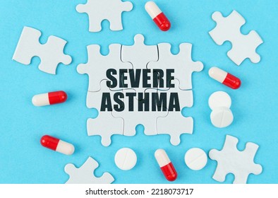 Medical Concept. On A Blue Background, Pills, Capsules And Puzzles With The Inscription - Severe Asthma