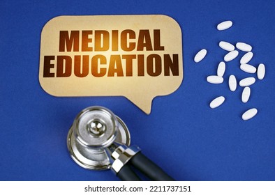 Medical Concept. On The Blue Surface Of The Tablet, A Stethoscope And A Cardboard Sign With The Inscription - MEDICAL EDUCATION