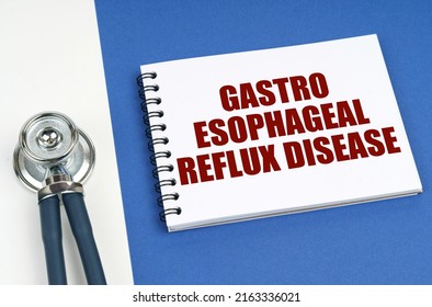 Medical Concept. On A Blue-white Surface Lies A Stethoscope And A Notepad With The Inscription - Gastro Esophageal Reflux Disease