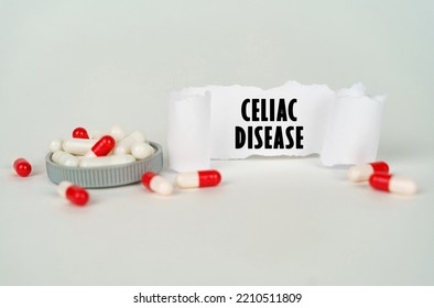 Medical Concept. On A Gray Background, Medical Capsules And A Paper Plate With The Inscription - Celiac Disease