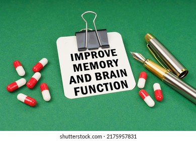 Medical Concept. On The Green Surface Of The Tablet, A Pen And A Notepad With The Inscription - Improve Memory And Brain Function