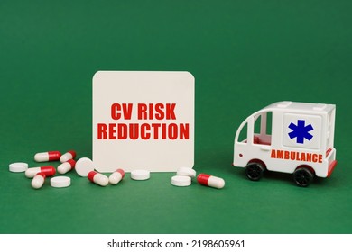 Medical Concept. On A Green Surface, An Ambulance, Pills And A Sign With The Inscription - CV Risk Reduction