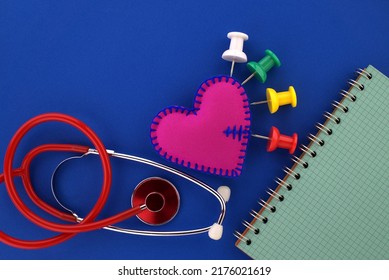 Medical Concept With Stethoscope And Red Heart And Open Wire Bound Notebook For Your Text