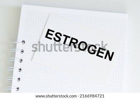 Medical concept, the text on the Estrogen card on the background of a notepad on the table ストックフォト © 