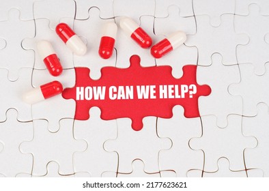 Medical Concept. There Are Pills On The White Puzzles, In The Middle There Is A Red Surface With The Inscription - How Can We Help