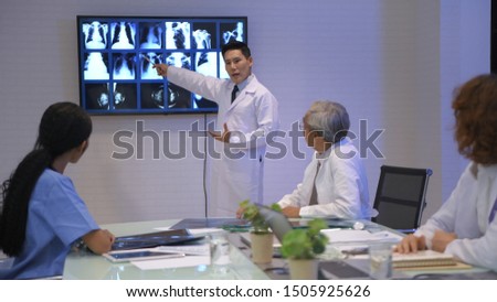 Medical concept. The young doctor is offering a new treatment to the medical community. 4k Resolution.