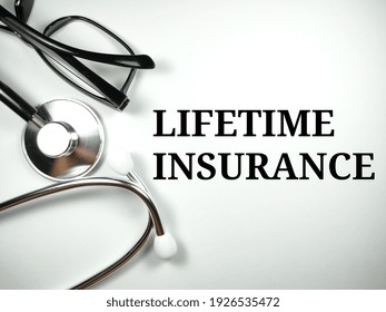 Medical Concept.Word LIFETIME INSURANCE With Stethoscope On White Background.