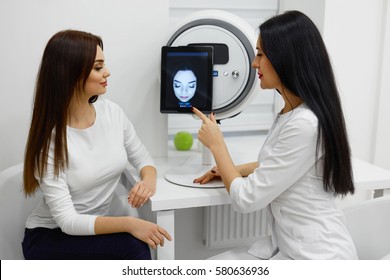 Medical Consultation. Closeup Of Beauty Doctor Giving Information To Woman About Condition Of Her Facial Skin. Beautician And Female Talking In Salon. Face Analysis Treatment. High Resolution