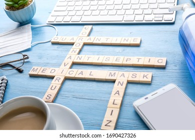 Medical Crossword, Phone, Mask On A Blue Table