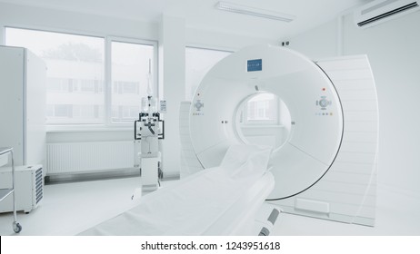 Medical CT Or MRI Or PET Scan Standing In The Modern Hospital Laboratory. Technologically Advanced And Functional Mediсal Equipment In A Clean White Room.