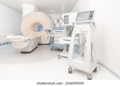 Medical CT or MRI Scan in the modern hospital laboratory. Interior of radiography department. Technologically advanced equipment in white room. Magnetic resonance diagnostics machine. - Shutterstock ID 2142359559