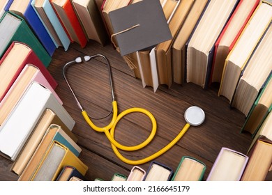 Medical Degree Education Concept - Stack Of Books In Heart Shape And Stethoscope In The Library. Love To Study Medicine