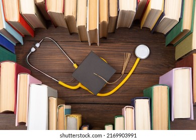 Medical Degree Education Concept - Stack Of Books In Heart Shape And Stethoscope In The Library. Love To Study Medicine