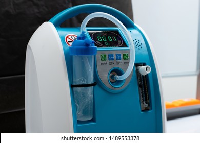 Medical Device Individual Blue White portable oxygen cylinder to put gas for patients with respiratory disorders, studio lighting black background