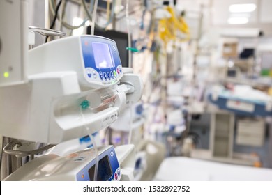 Medical Device In UK EMS ICU Hospital Room,infusion Pump Dripping Intravenous Fluid,US Coronavirus COVID-19 Epidemic Pandemic,NHS Clinic Quarantine Isolation,blurred Out Of Focus Background,copy Space