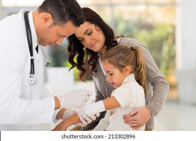 medical doctor bandaging injured patient in hospital - Powered by Shutterstock