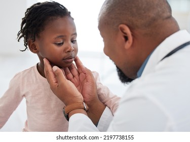 Medical Doctor Checking A Girl Throat With Care In His Office At A Modern Surgery Center. Man Pediatrician Touching The Patients Neck During Healthcare, Medicare And Illness Consultation At Clinic