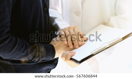 Similar – Female doctor filling out a questionnaire to senior patient