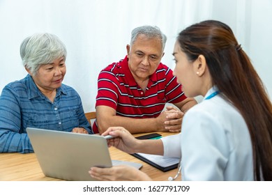 Medical Doctor Explaining Unhappy Result To Senior Elder Patient Couple Man And Woman