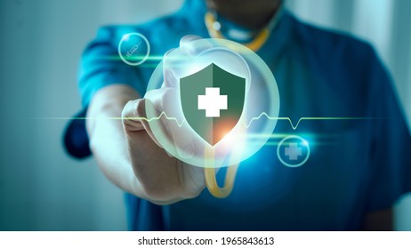 Medical doctor female holding stethoscope, immunity shield for protection from virus and bacterias, virus germs and prevention disease. - Shutterstock ID 1965843613