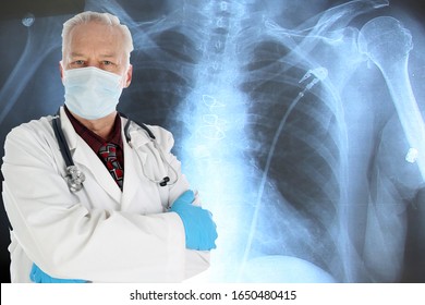 Medical Doctor. A Handsome Medical Doctor Or Surgeon Stands In Front Of An X-Ray. Medical Doctors Help People With Health Issues World Wide On A Daily Basis. See Your Doctor Today And Stay Healthy. 